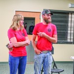 North Captain Wes Mangus (right) addresses the audience to express his thanks to Morgan DuFort, who ramrodded the Defender Service Awards effort for Big Horn County SAR and has also performed a lot of grant writing for the squad. David Peck