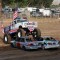 Before the Demolition Derby begins on Saturday, a monster truck parks in the center of the arena carrying the American Flags for the National Anthem. Dakoby Bentley
