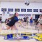Senior Ellie Holloway reaches to save the ball as her teammates watch in anticipation during last Friday afternoon’s homecoming game in the Buff Gym. Lisa Kunkel