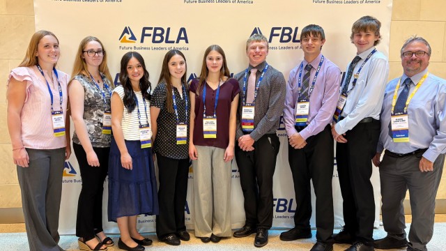 Greybull High School FBLA students pose for a group photo at the Henry B. González Convention Center in San Antonio, Texas last week. From left, Ella Keisel, Caden Thacker, Joey Boyer, Reagan Vigil, Fallon Hoffman, Bennett Sanford, Caden Hunt, Landen Craft and Mark Sanford. photo courtesy of Heather Sanford