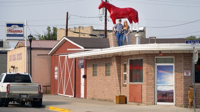 Lindsay Jones, right, and Rob Klitzke stand on the roof of The Sorrel Lounge in downtown Greybull last Saturday. Lisa Kunkel
