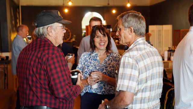 Wyoming Business Council’s community leadership and engagement manager Amber Power, center, talks with Gerald Crist, right, and Steve Helburn last Thursday morning in the Wyld Sage Coffeehouse in Greybull. Lisa Kunkel